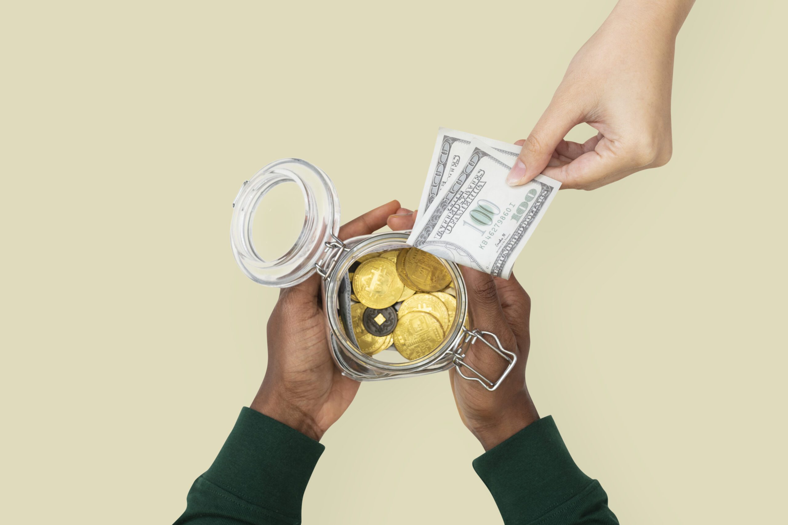 Money jar held by hands finance savings concept